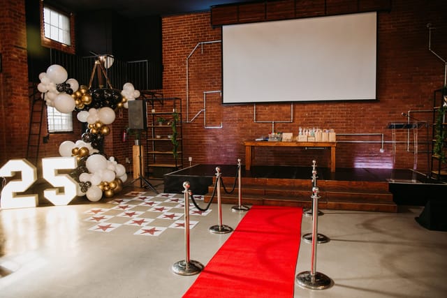 Stylish LOFTIC Boardroom with bold "25" marquee for milestone celebrations.