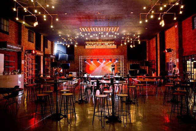 LOFTIC Boardroom: stylish event space with industrial decor for meetings and celebrations.