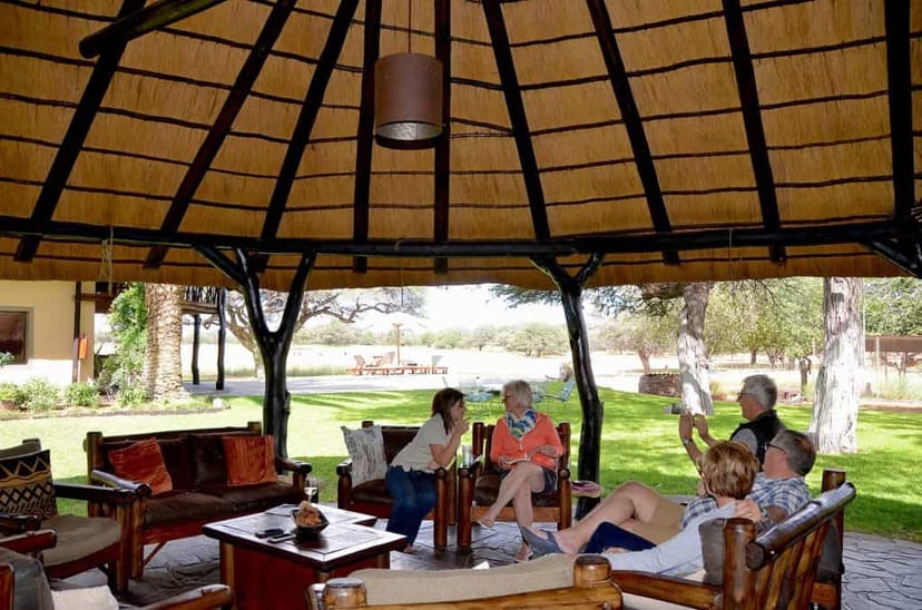 Thatched Lapa outdoor lounge for relaxed networking in a serene setting.