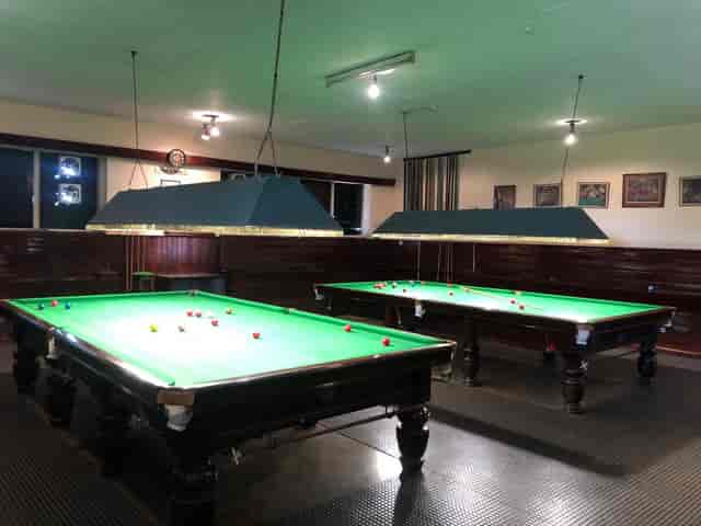 Bullseye Bar at Nairobi Gymkhana with snooker tables for team-building events.