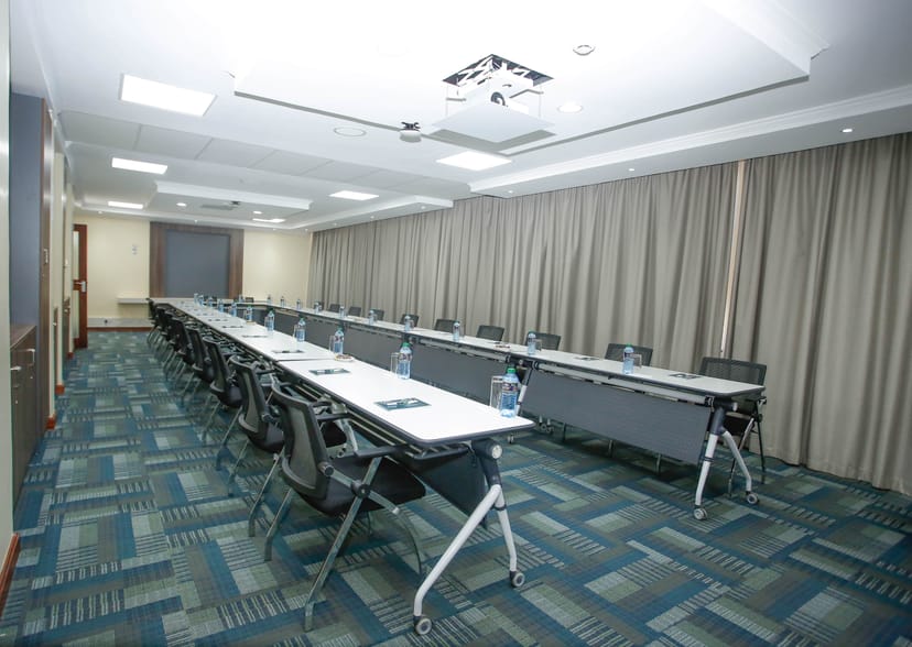 Modern Multi-Purpose Hall with adaptive seating, ideal for workshops and meetings.