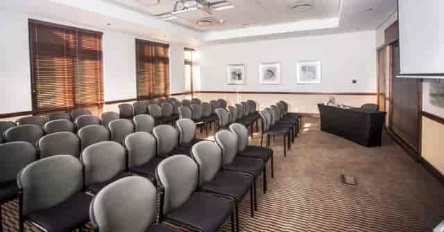 Conference venue in Montecasino with gray chairs, ideal for workshops and meetings.
