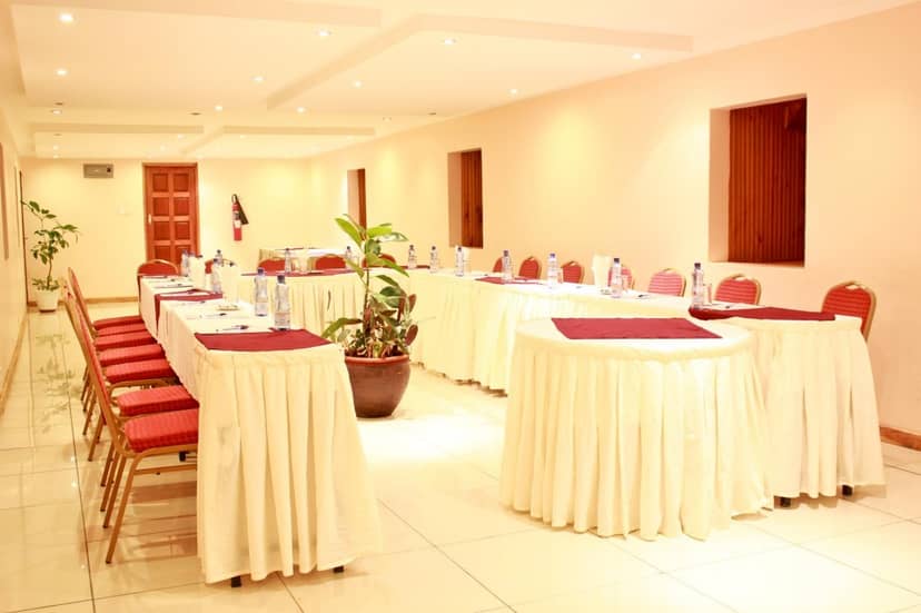 Blue Carpet Conference Room at Hennessis Hotel, elegant setup for workshops and meetings.
