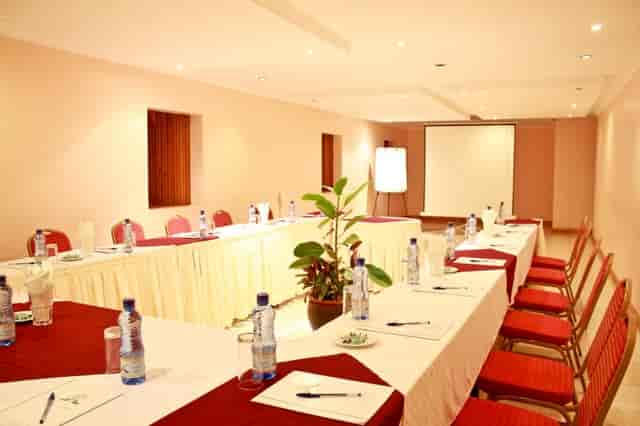 Blue Carpet Conference Room with U-shaped table for meetings and workshops at Hennessis Hotel.
