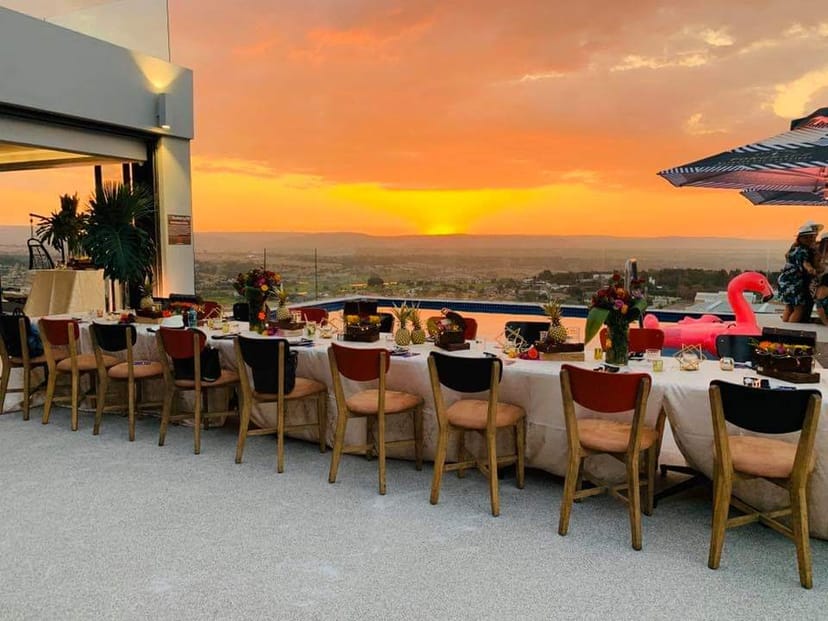 Rooftop bar at Blueberry Hill Hotel with sunset view, ideal for upscale events and cocktails.