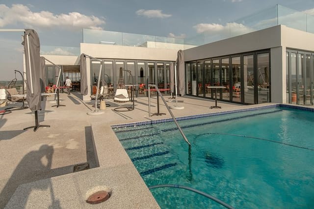 Rooftop bar at Blueberry Hill Hotel with pool, perfect for events and meetings.