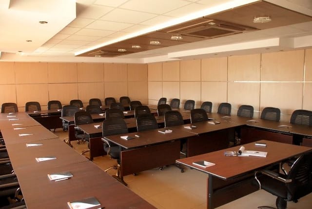 Conference room with ergonomic seating for professional meetings at College of Insurance.
