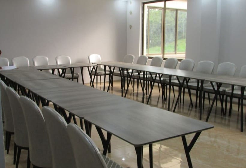 Conference room in FK Resort with long tables and natural light for workshops and seminars.