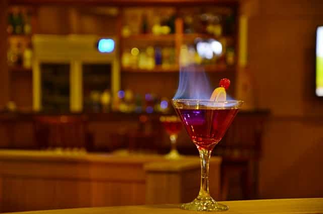 Flaming cocktail in a martini glass at Art & Soul Conference Room, perfect for upscale events