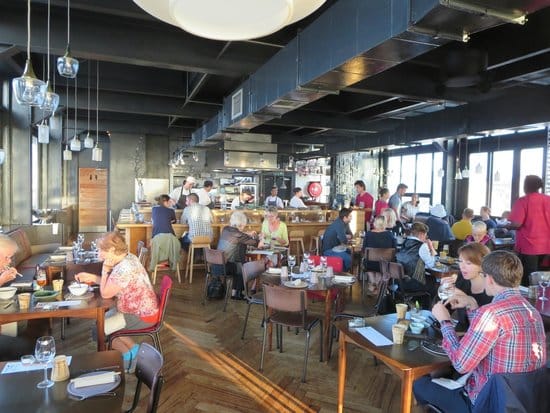Vibrant dining area at The Potluck Club for networking events and corporate dinners.