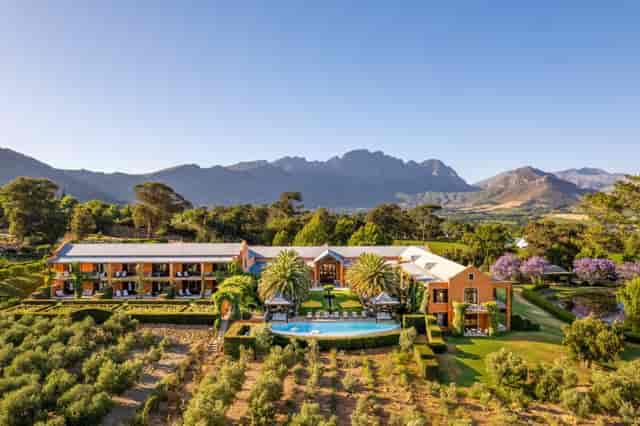 Loggia at La Residence: Scenic venue for corporate retreats with lush gardens and mountain view.