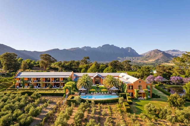 Loggia at La Residence: Scenic venue for corporate retreats with lush gardens and mountain view.