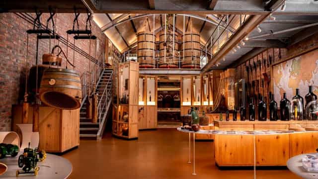 Stylish industrial venue with rustic brick walls for corporate events and wine tastings.