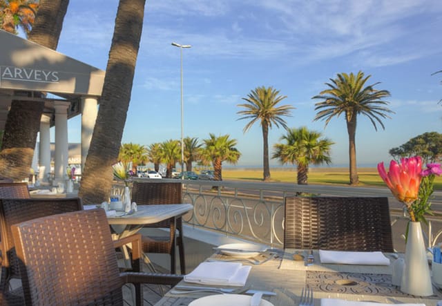 Outdoor dining area at La Perla Restaurant, ideal for corporate events and team retreats.