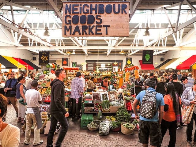 "Vibrant market scene at The Old Biscuit Mill for community events and networking."