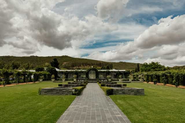 Ivy-Covered Chapel in Belair: a serene wedding venue with lush gardens and stone pathways.