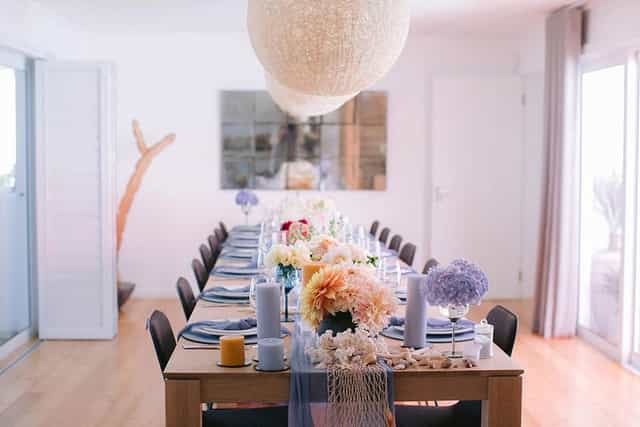 Elegant dining meeting room with floral centerpiece for upscale events and celebrations.