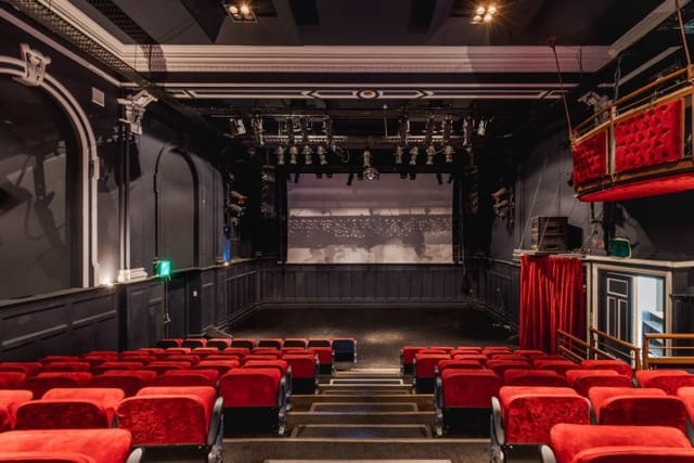 Stylish balcony at The Wave Theatre with plush seating for intimate events and presentations.