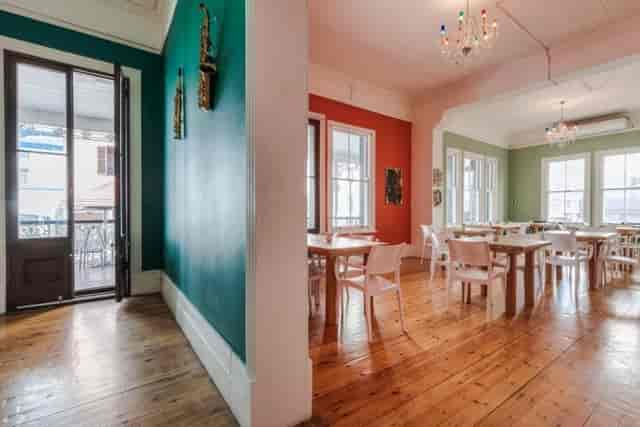 Alt tag: "Versatile balcony meeting space in The Wave Theatre with vibrant colors for events."
