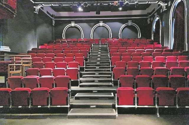 The Wave Theatre exhibition area with tiered red seating, ideal for performances and presentations.