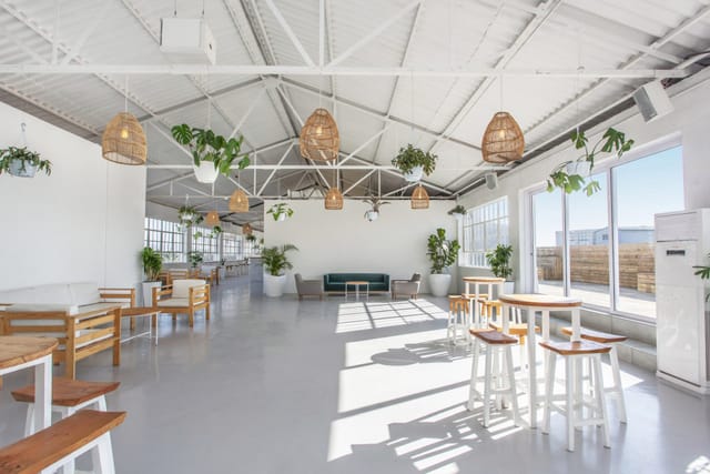 Modern reception area at The Terrace Rooftop with natural light, ideal for events.