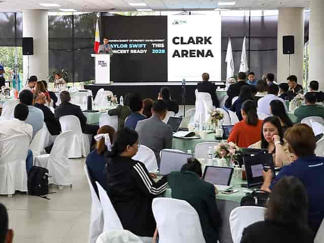 Johnson Hall event space with tables, floral centerpieces, for a Taylor Swift concert conference.