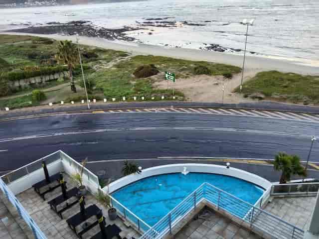 Coastal conference centre with poolside area, perfect for meetings and events.