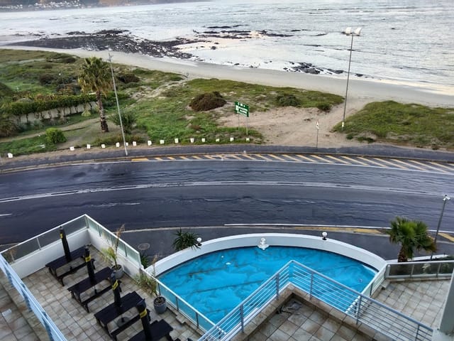 Coastal conference centre with poolside area, perfect for meetings and events.