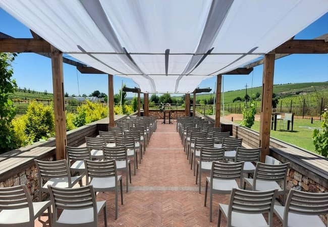 Outdoor event space at Eikenhof Estate with chairs under canopy for ceremonies.