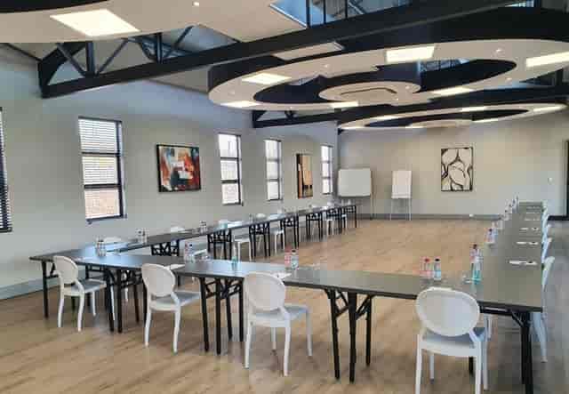 Spacious conference room at Eikenhof Estate, U-shaped layout for meetings and networking.