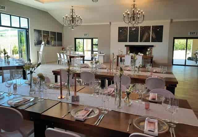 Elegant Cap Classique venue with floral centerpieces, ideal for weddings or corporate events.