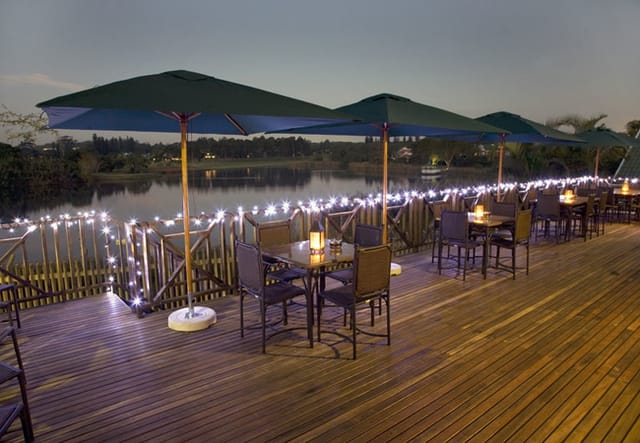 Elegant outdoor Kingfisher Room venue with stylish seating for evening events at Mount Edgecombe.