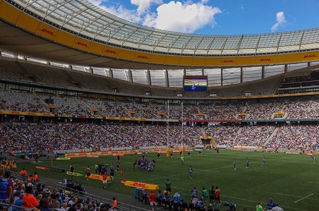 Vibrant DHL Stadium during a live sports event with ample seating and electrifying atmosphere.