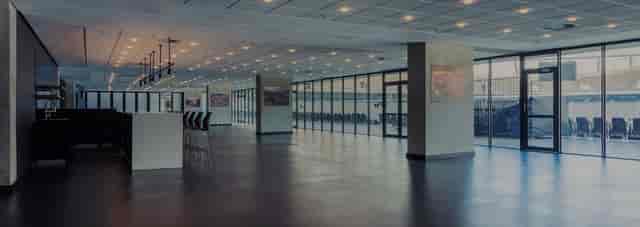 Contemporary event space in DHL Stadium with floor-to-ceiling windows, ideal for corporate events.