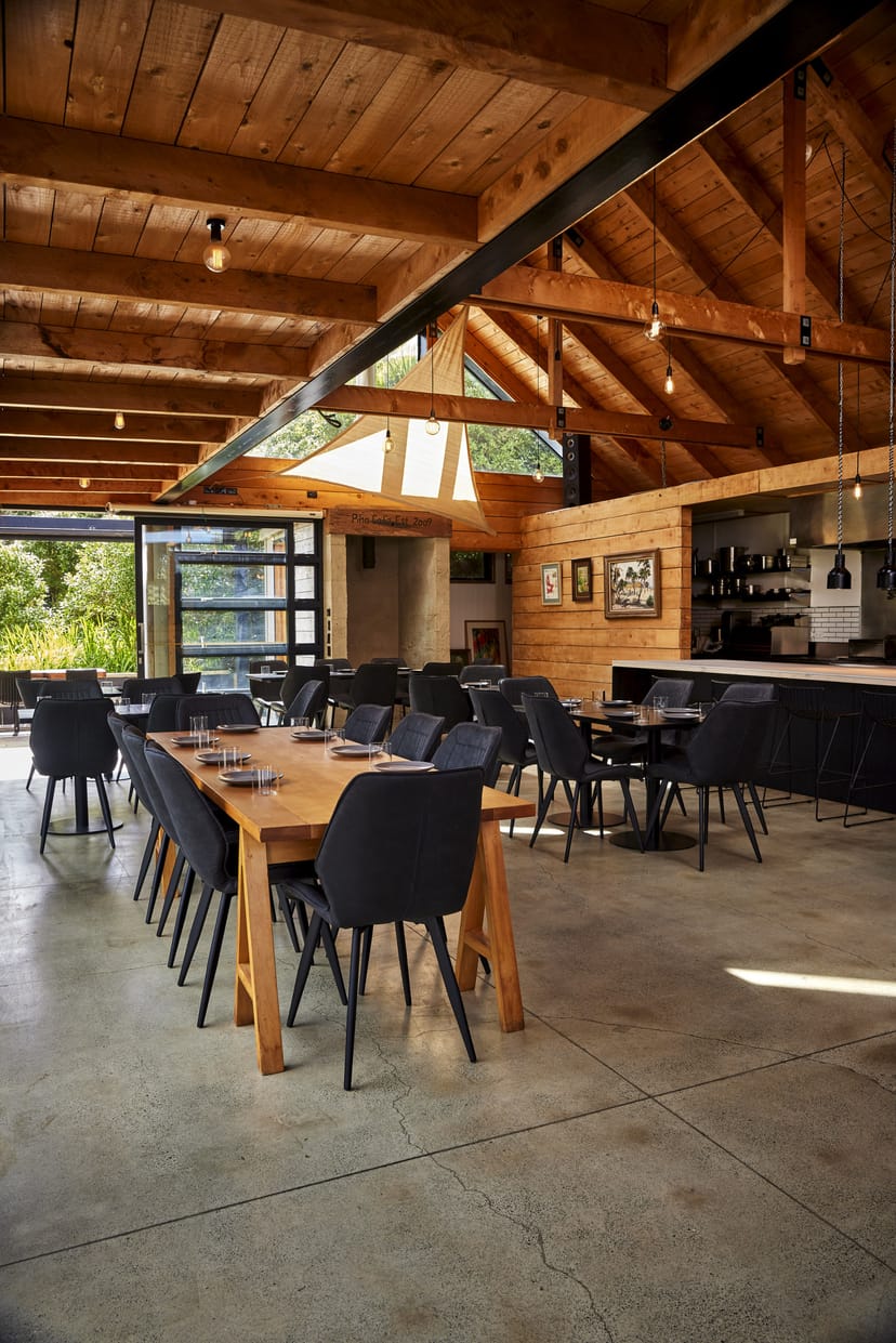 Contemporary event space with large windows for corporate gatherings or private meetings