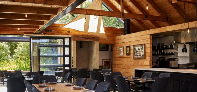 Modern rustic dining area in Aryeh, perfect for intimate gatherings and corporate events.