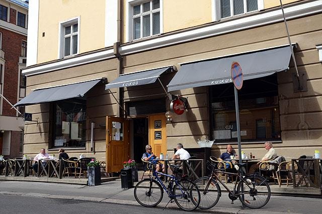 Terrace seating at Ravintola Kuu for casual networking and meetings in an urban café.