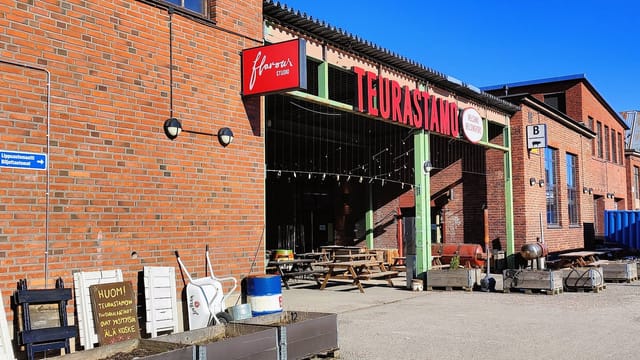 Culinary school Flavour Studio: rustic venue with outdoor seating for workshops and events.