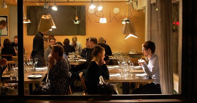 Vibrant dining setup in Kaskis Restaurant for corporate events and networking dinners.