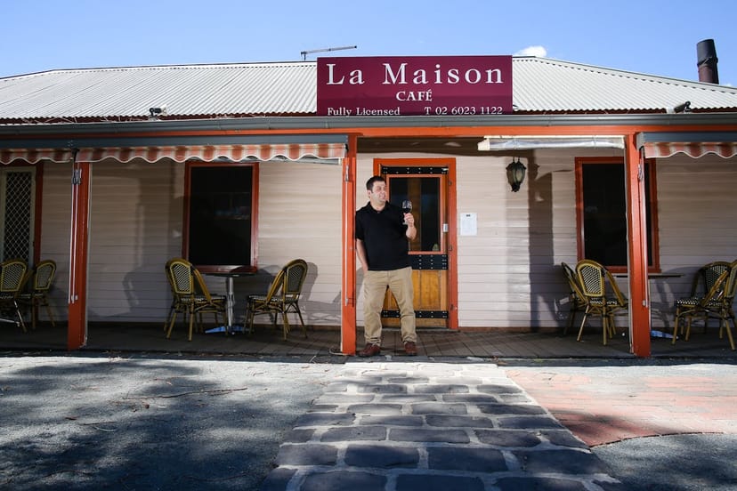 Charming outdoor bar at La Maison Restaurant, perfect for casual meetings and events.