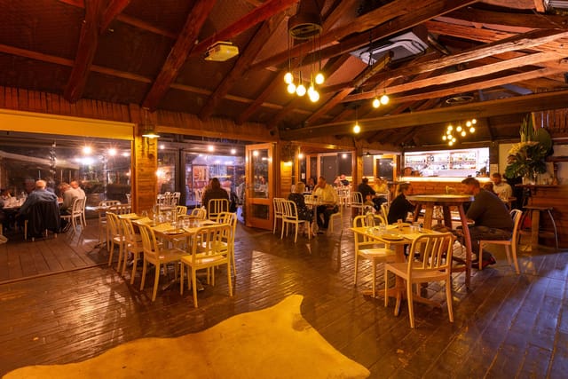 Cozy bar at La Maison Restaurant for intimate gatherings and dining events.