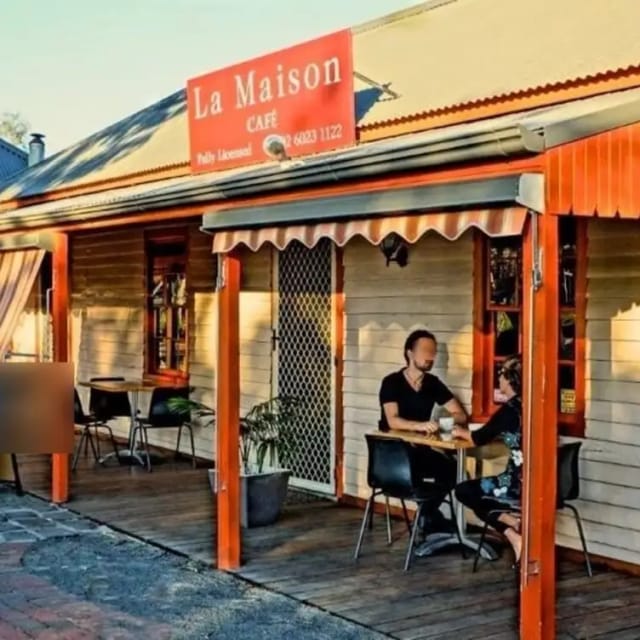 Cozy outdoor bar at La Maison Restaurant, perfect for intimate meetings and networking events.
