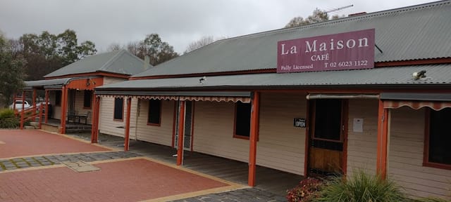 "Charming La Maison Café with rustic exterior for intimate events and meetings."