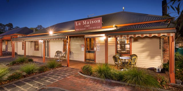 Charming café exterior at La Maison Restaurant for intimate gatherings and events.