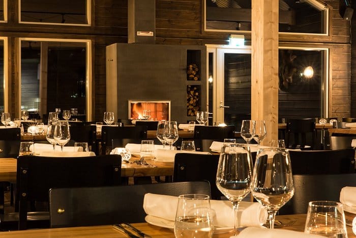Main Restaurant at Northern Lights Ranch with elegant glassware for business dinners.