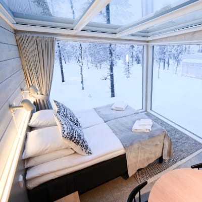 Cozy multifunctional room with large windows at Northern Lights Ranch, ideal for retreats.