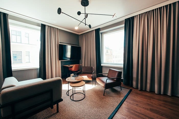 Modern Living Room Club at Clarion Hotel, ideal for meetings and brainstorming sessions.