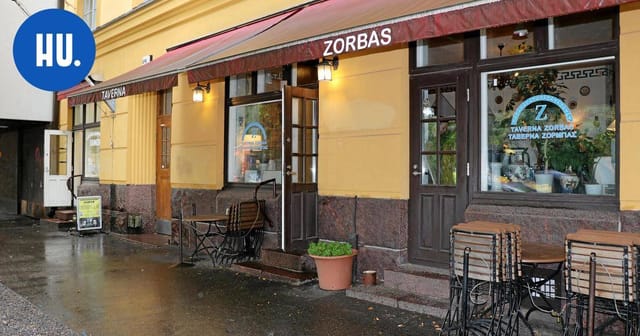 "Charming outdoor dining area at Taverna Zorbas, ideal for casual meetings and events."