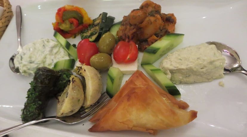 Dining area with antipasto platter for upscale networking event at Taverna Zorbas.