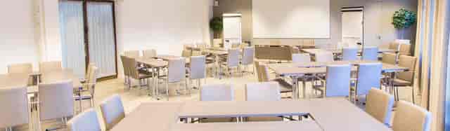 Modern meeting room at Hotel Haaga Central Park with flexible seating for workshops.